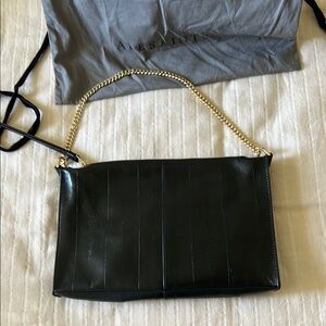 All Saints Black and Gold Shoulder Bag with Sleek Design